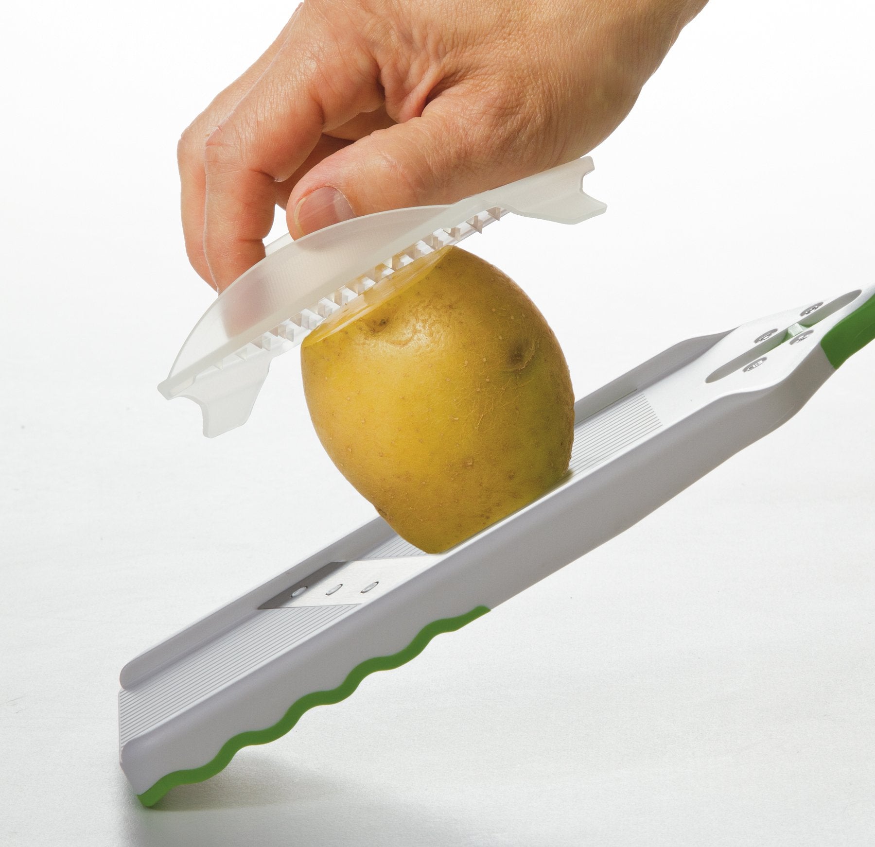 PrepSolutions slicing a potato to show even cuts and time-saving prep benefit