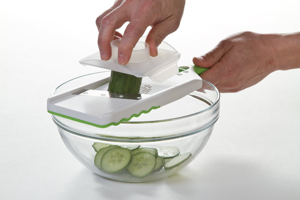 PrepSolutions size comparison next to a cutting board showing compact footprint