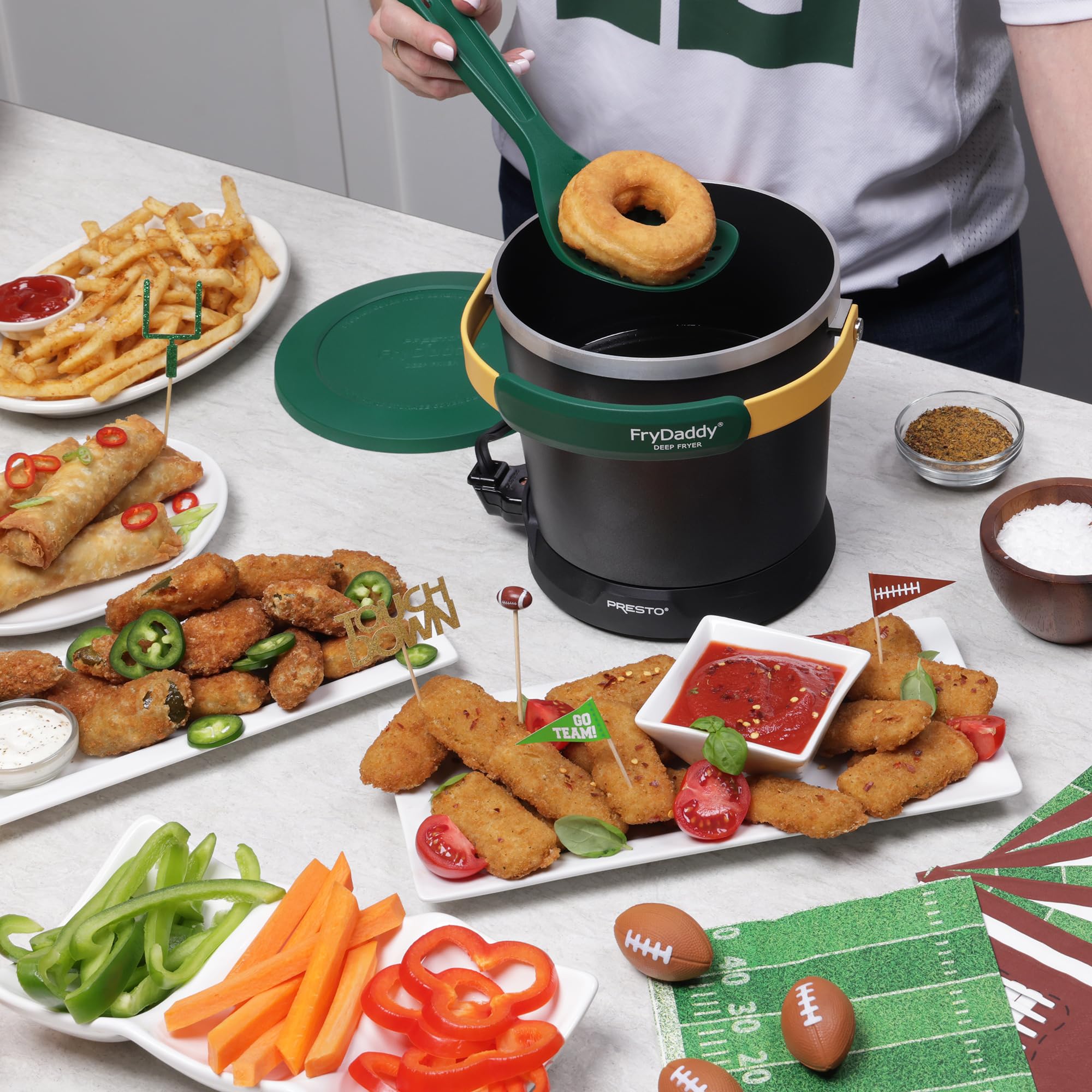 Presto FryDaddy next to a soda can to show compact size and countertop-friendly footprint
