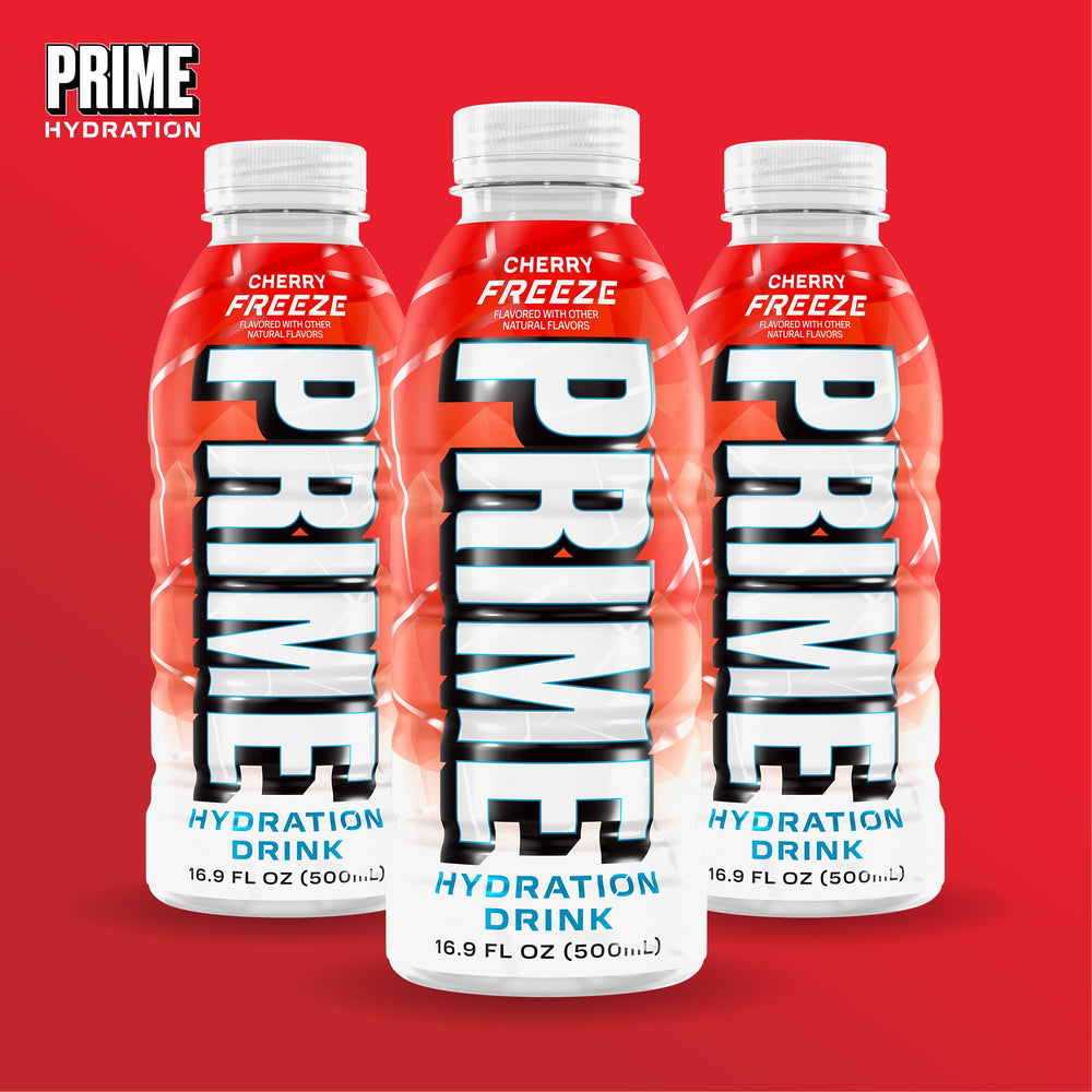PRIME Hydration Cherry Freeze held outdoors in lifestyle scene showing active refreshment benefit
