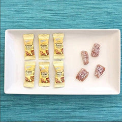 Prince of Peace ginger chews being removed from bag in a travel setting for portable convenience