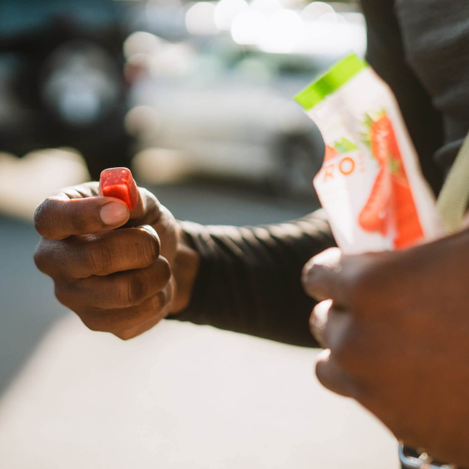 PROBAR Bolt chews in athlete hand to show size and portable convenience