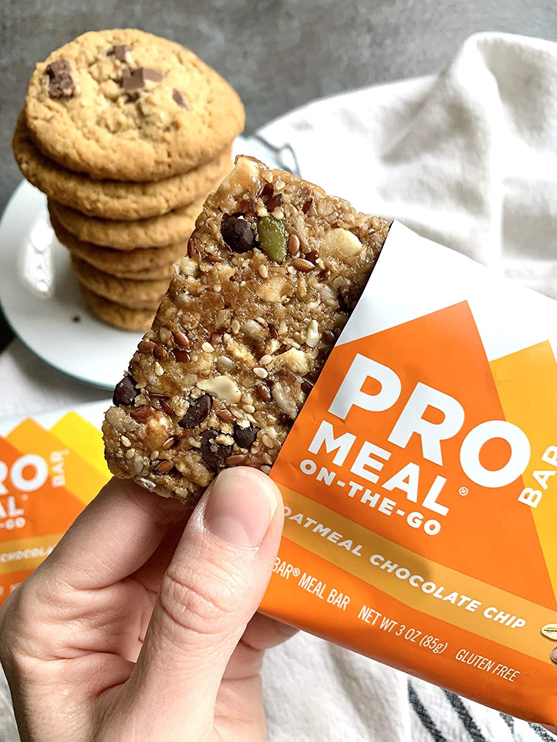 PROBAR bar beside a smartphone for scale showing compact meal replacement convenience