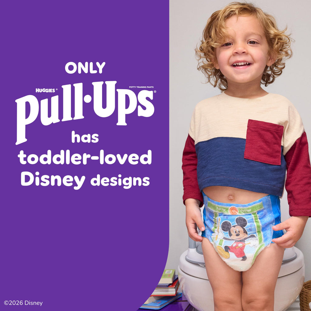 Pull-Ups being changed while child stands, brand showing fast convenience