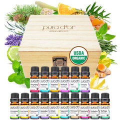 PURA D'OR Sweet16 box front showing 16 essential oil bottles and wooden case benefit variety