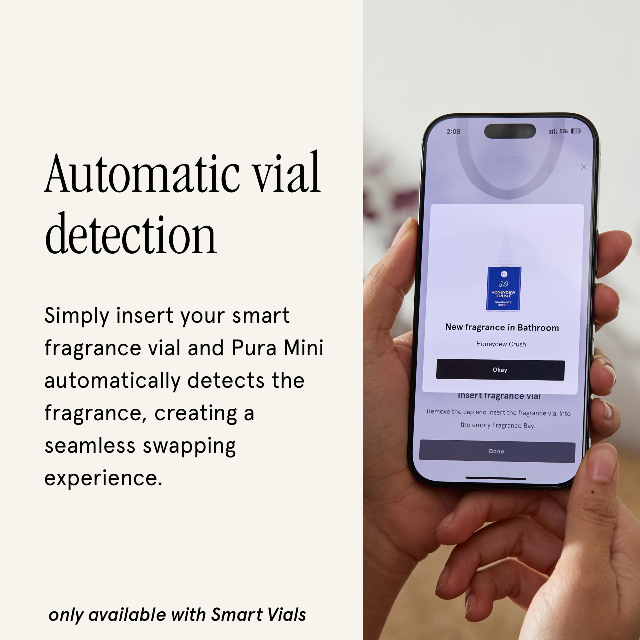 Pura mini beside a phone for scale, showing compact size and discreet placement benefit