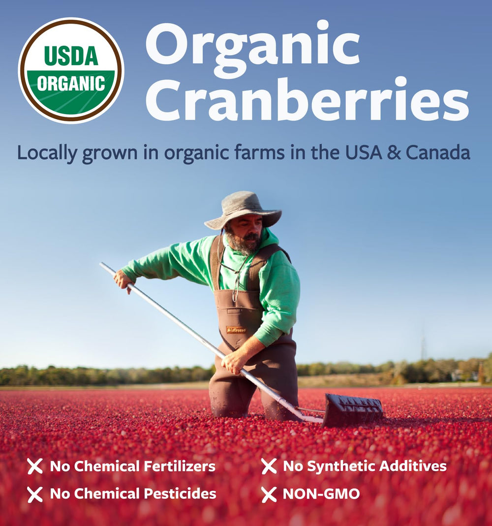 PURE CO bottle beside fresh cranberries illustrating North American organic sourcing