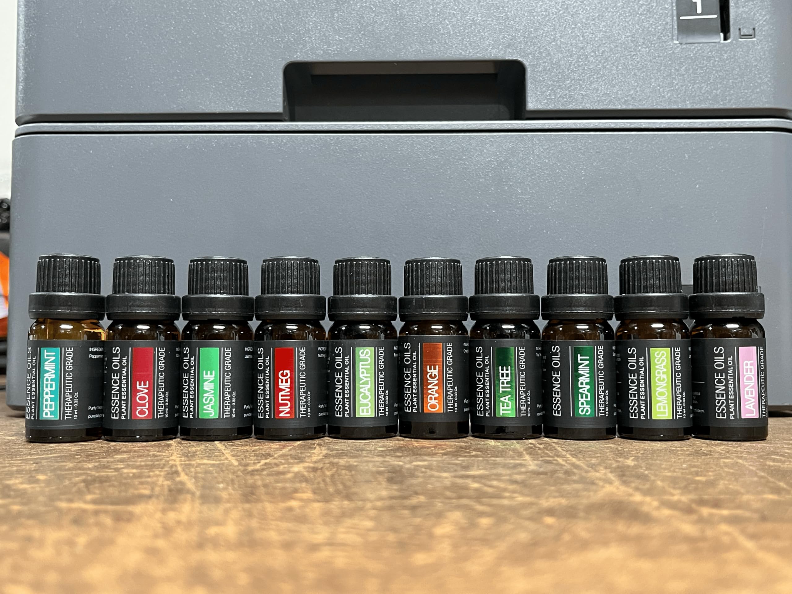 Pure Daily Care diffuser next to smartphone showing compact size and portability