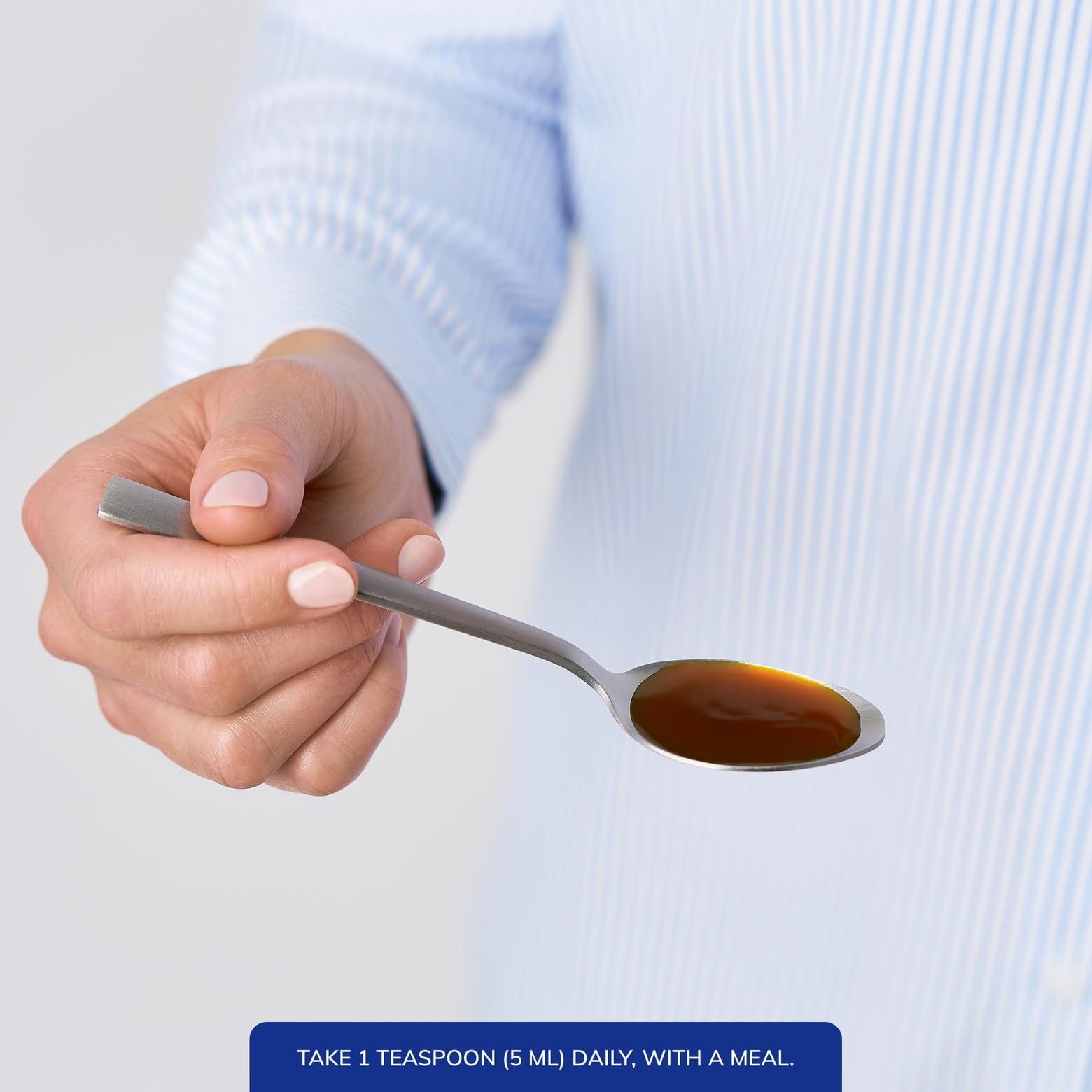Pure Encapsulations pouring a 5 mL serving into the cap for convenient measured dosing