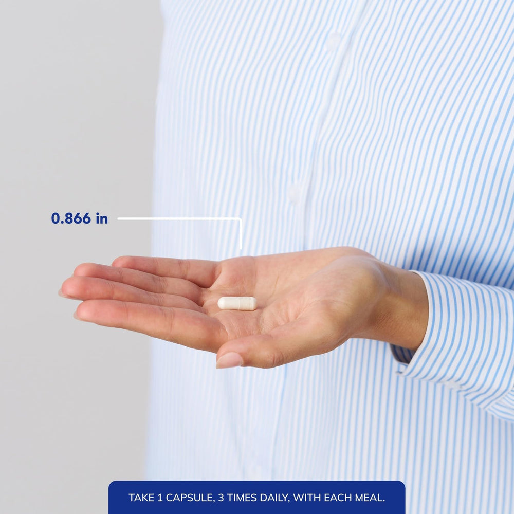 Pure Encapsulations capsules in hand demonstrating recommended serving size convenience