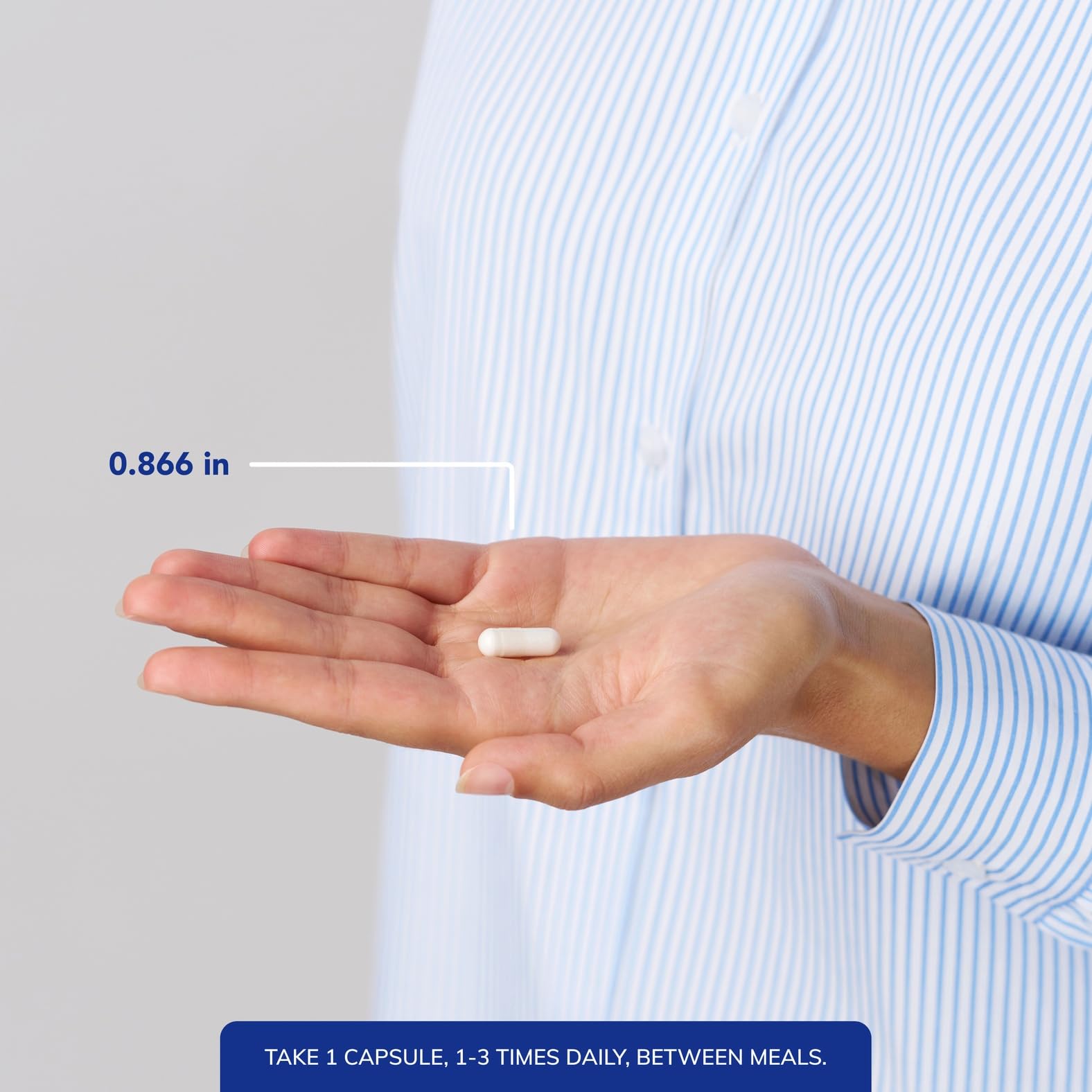 Hand holding one Pure Encapsulations NAC capsule for size and dosing clarity benefit
