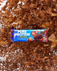 Pure Protein unwrapped bar close-up showing cereal crunch and smooth coating benefit