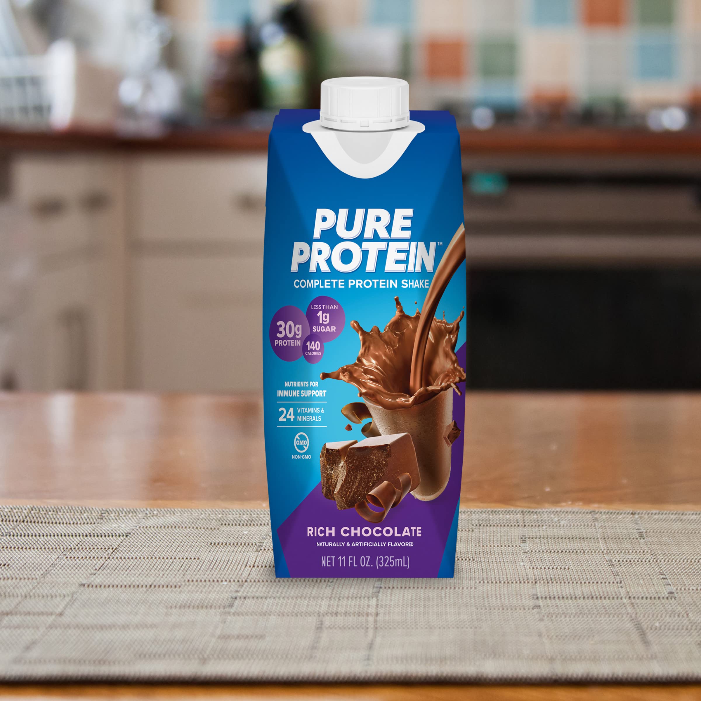 Pure Protein bottle on breakfast table paired with fruit for balanced fuel