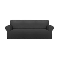 PureFit front view on large sofa showing full coverage and refreshed look