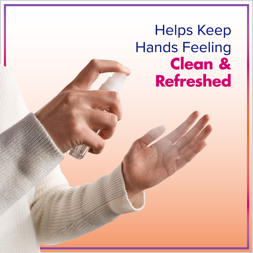 PURELL two 2 fl oz bottles in hand displaying TSA-friendly size and scale