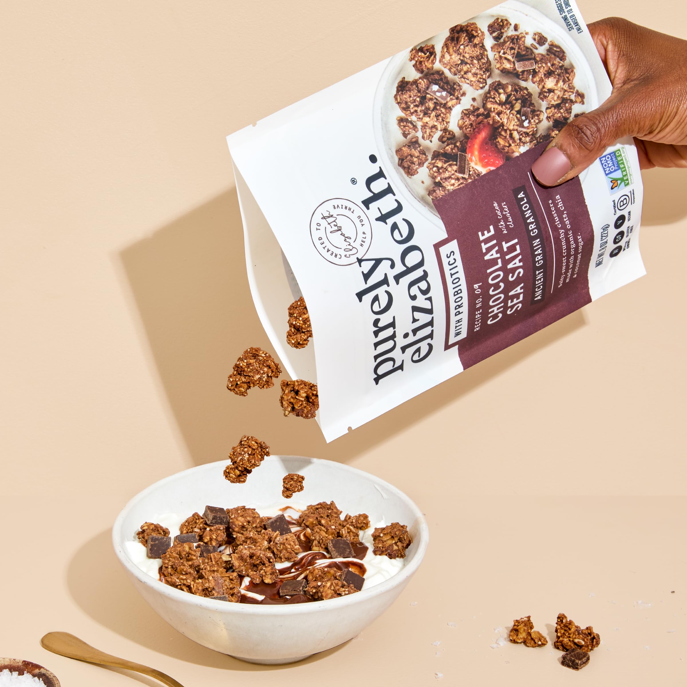 purely elizabeth granola served in a bowl with milk, demonstrates easy breakfast and satiety benefit