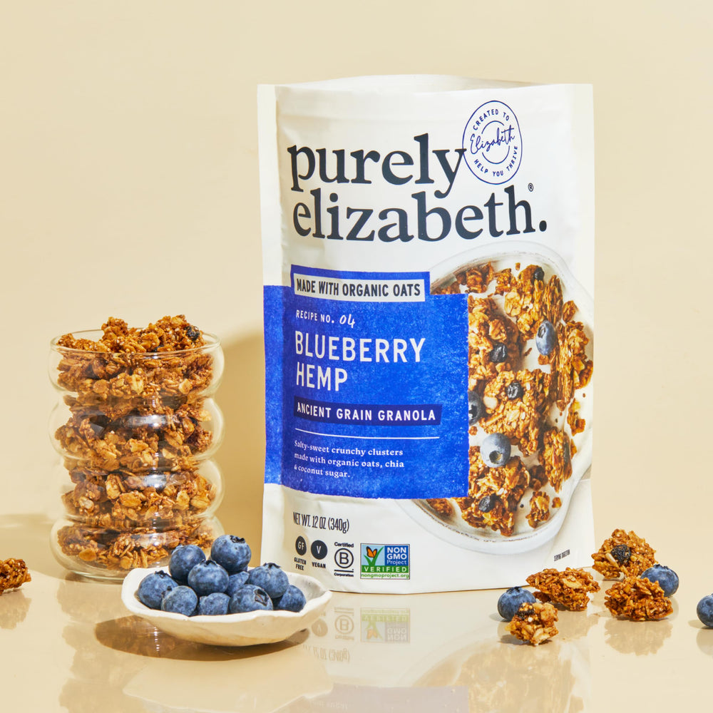 Purely Elizabeth spoon sprinkling granola over yogurt for added crunch