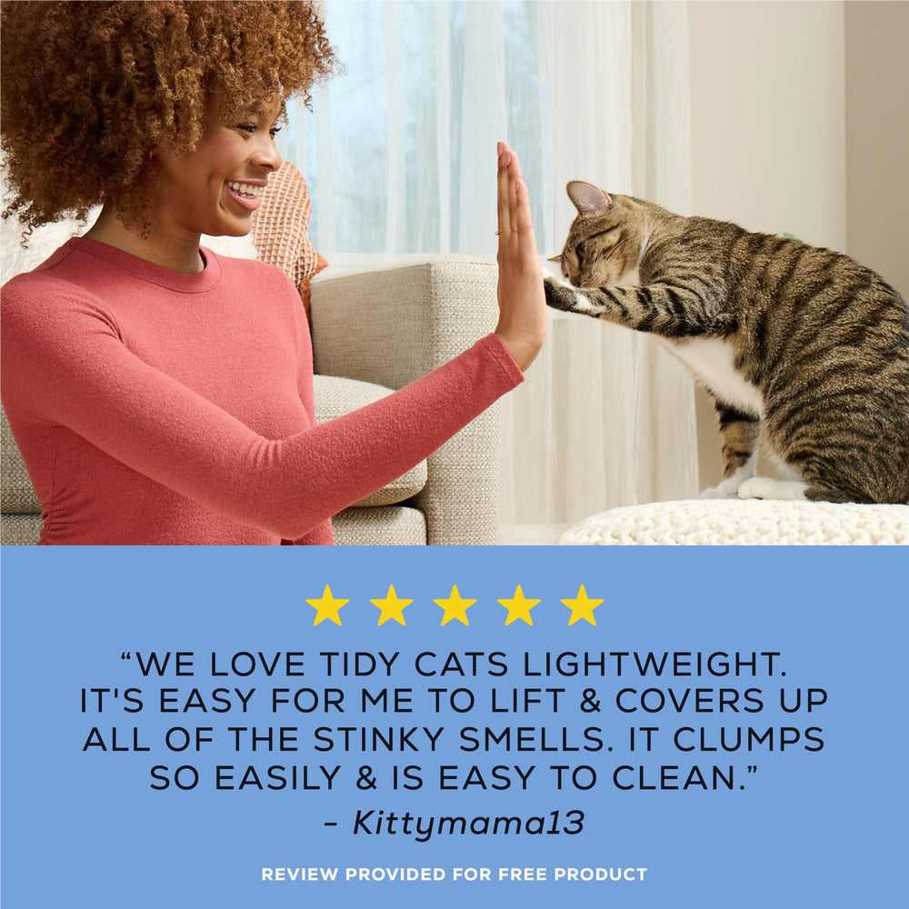 Purina Tidy Cats placed in a tidy bathroom setting showing fresh scent benefit