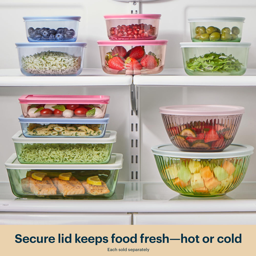 Pyrex bowls nested with lids, illustrating compact storage and space-saving benefit