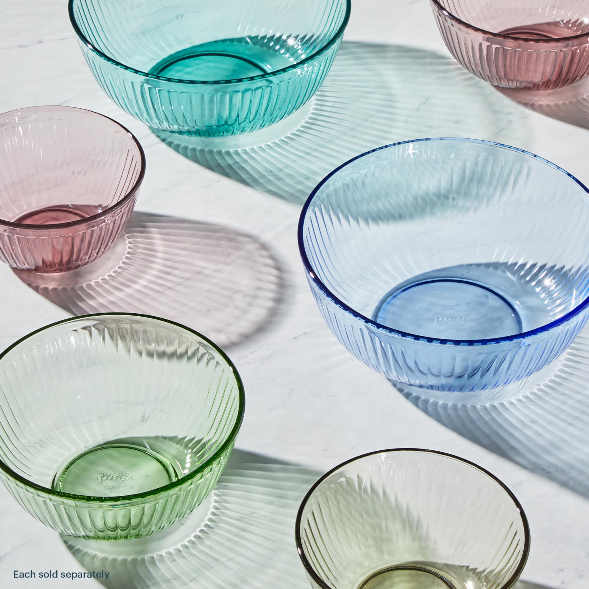 Pyrex bowls side-by-side with fruit for scale, demonstrating capacity choices and portion guidance