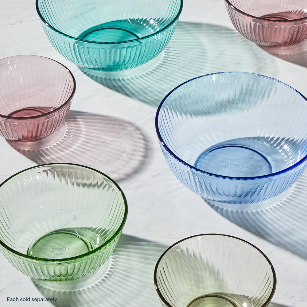 Pyrex bowls side-by-side with fruit for scale, demonstrating capacity choices and portion guidance