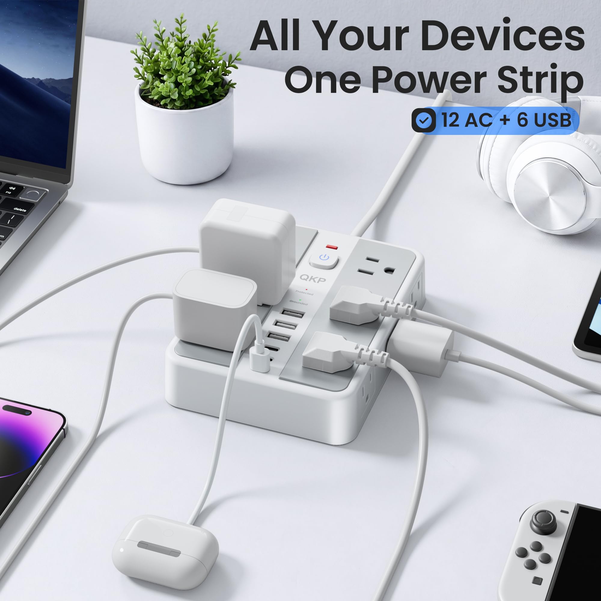 QKP power strip in a home office desk setup reducing clutter and chargers