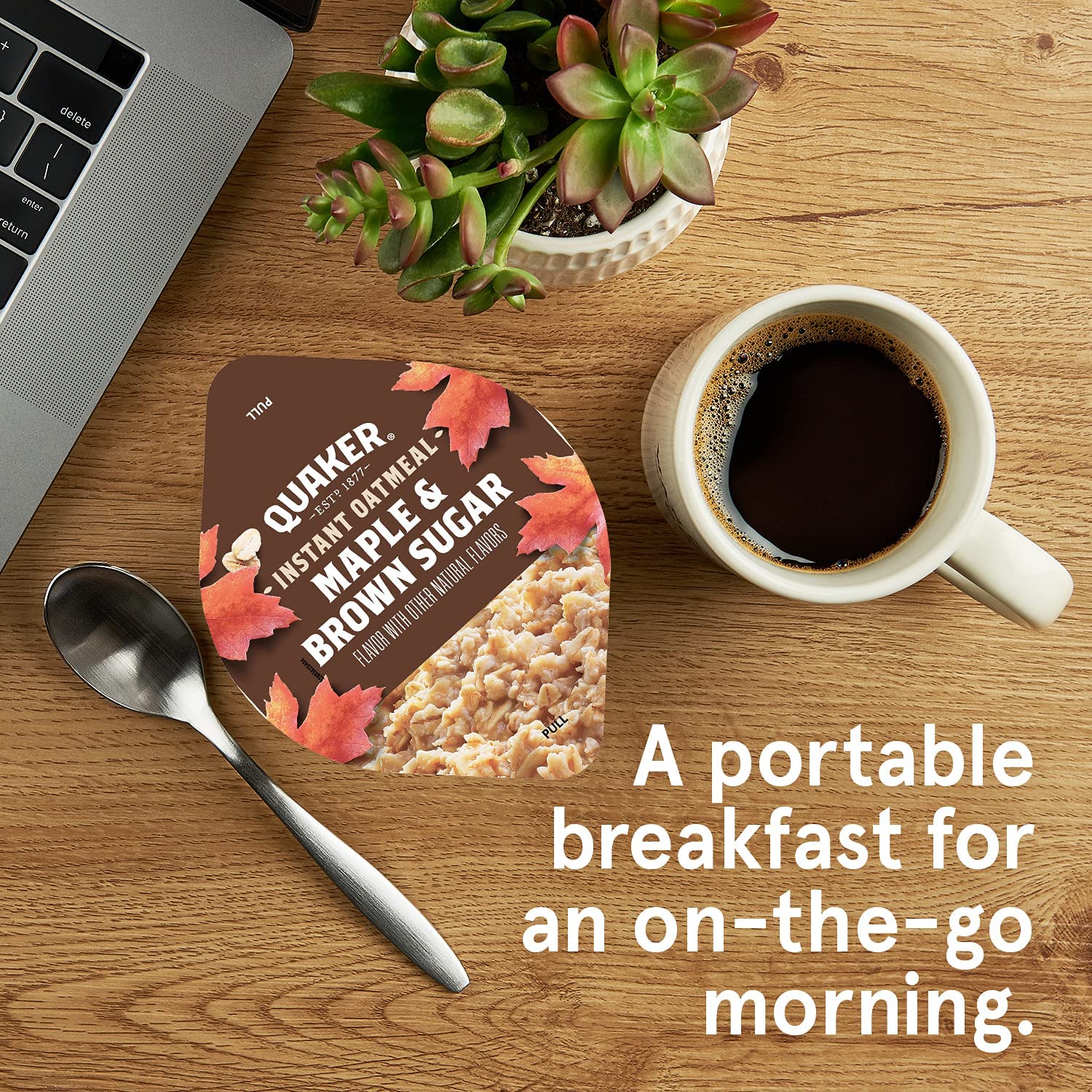 Quaker cup held in hand to show single-serve portion and portability