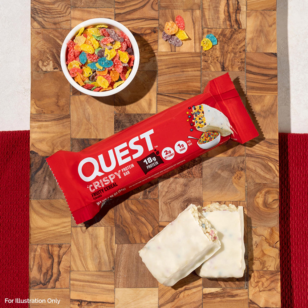 Quest bar on desk beside coffee for a quick office snack