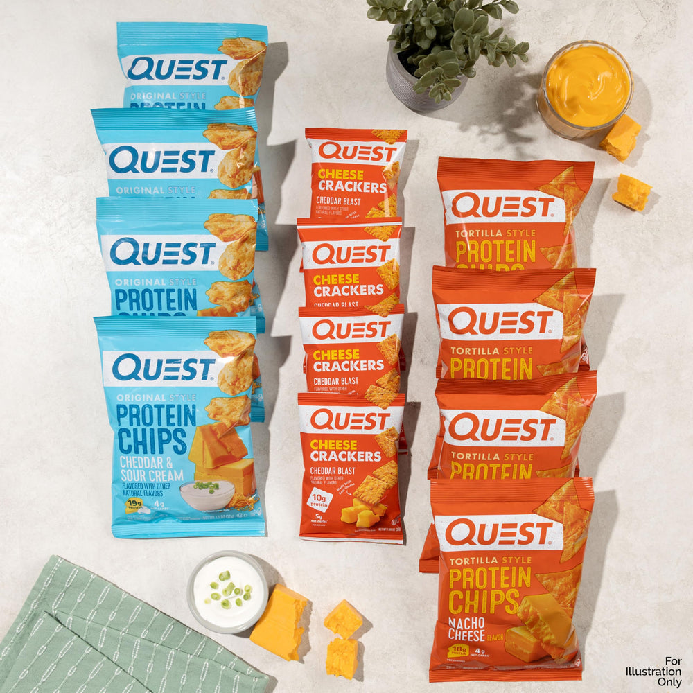 Hand holding Quest Nacho Cheese tortilla chip demonstrating portion size