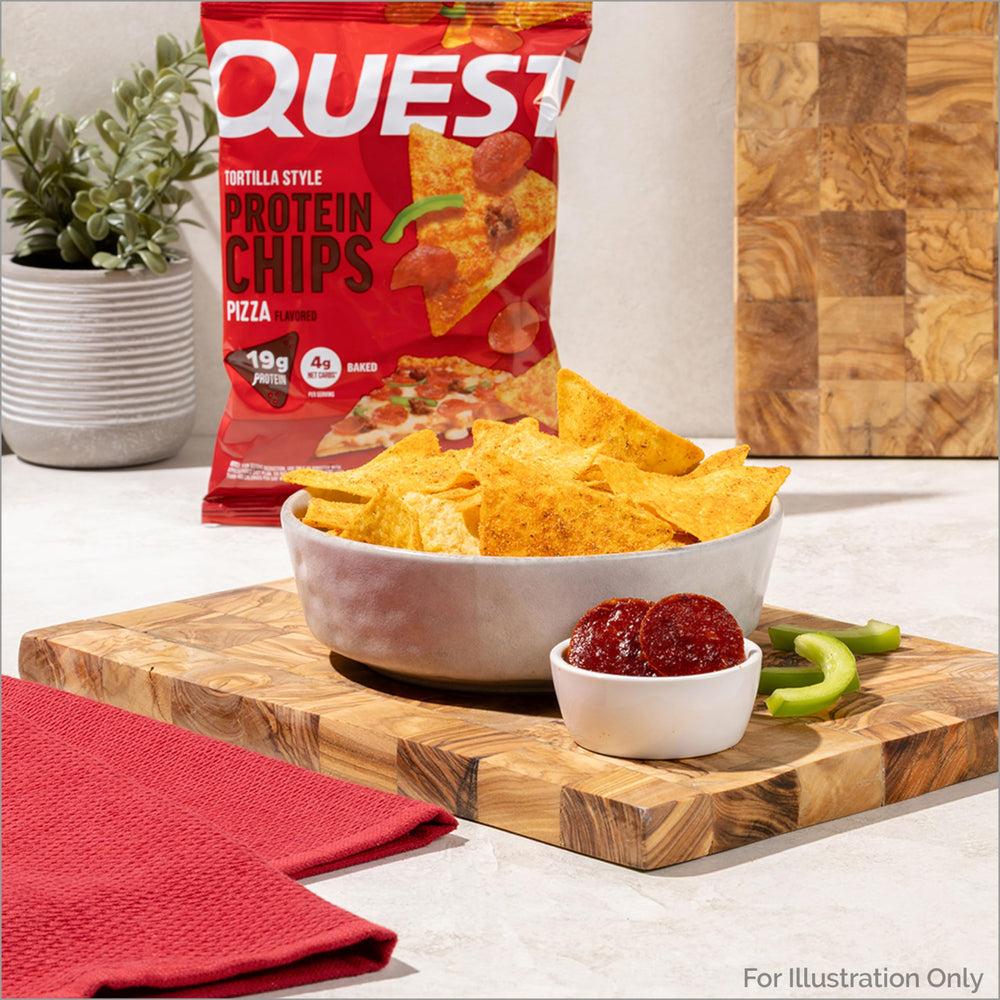 Quest bag beside a hand and phone to show compact single-serve size benefit