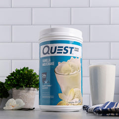 Shaker bottle mixed with Quest creating creamy shake for quick post-workout recovery