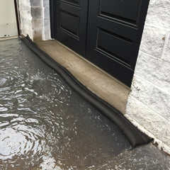 Quick Dam placed at garage threshold blocking water to protect interiors