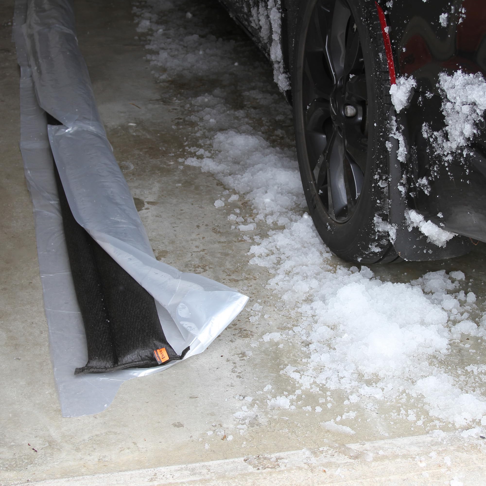 Quick Dam set on driveway diverting runoff away from door for property safety