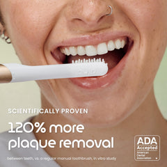 Quip brush head close-up displaying soft bristles for gentle gum protection