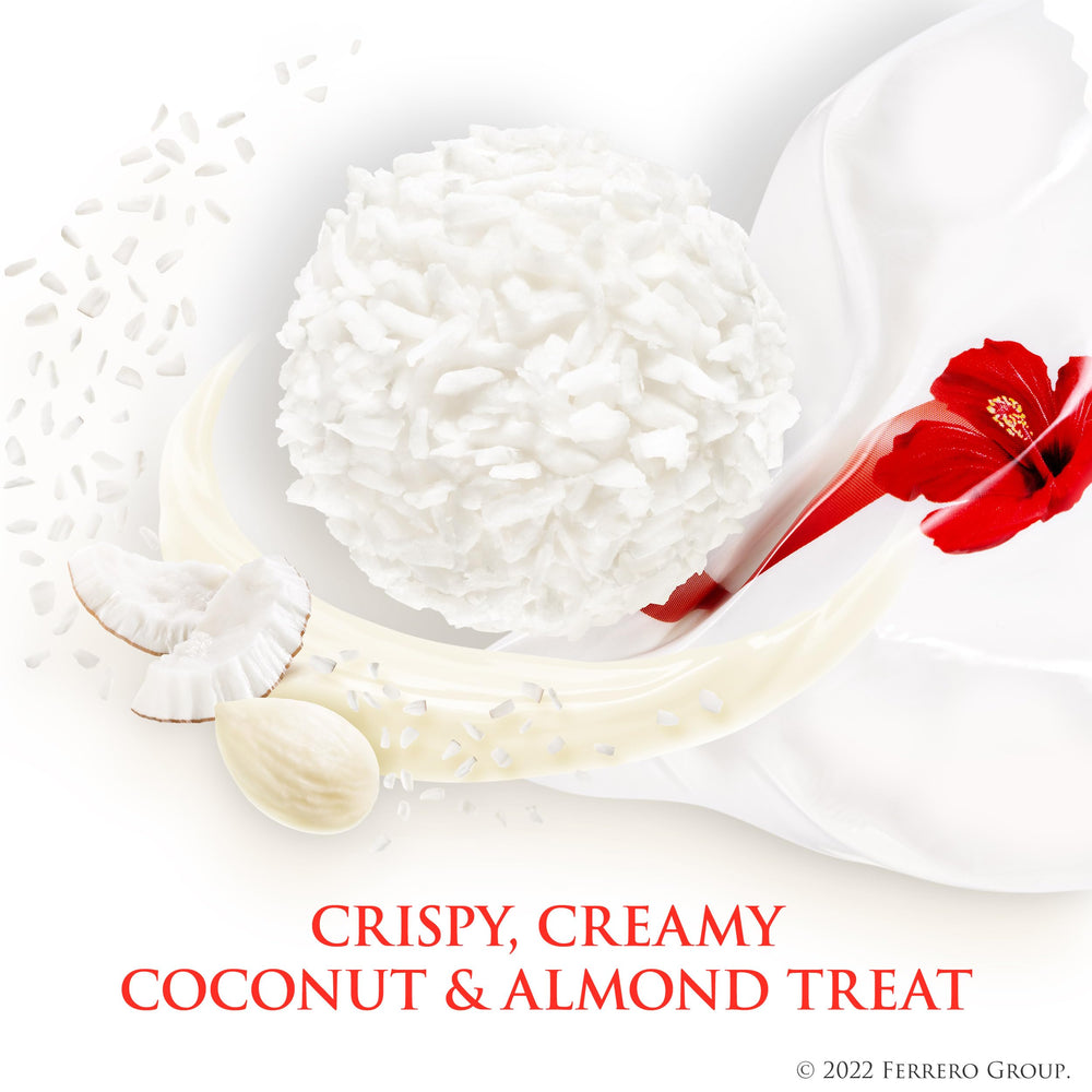 Raffaello single praline closeup revealing almond, creamy filling and coconut for texture