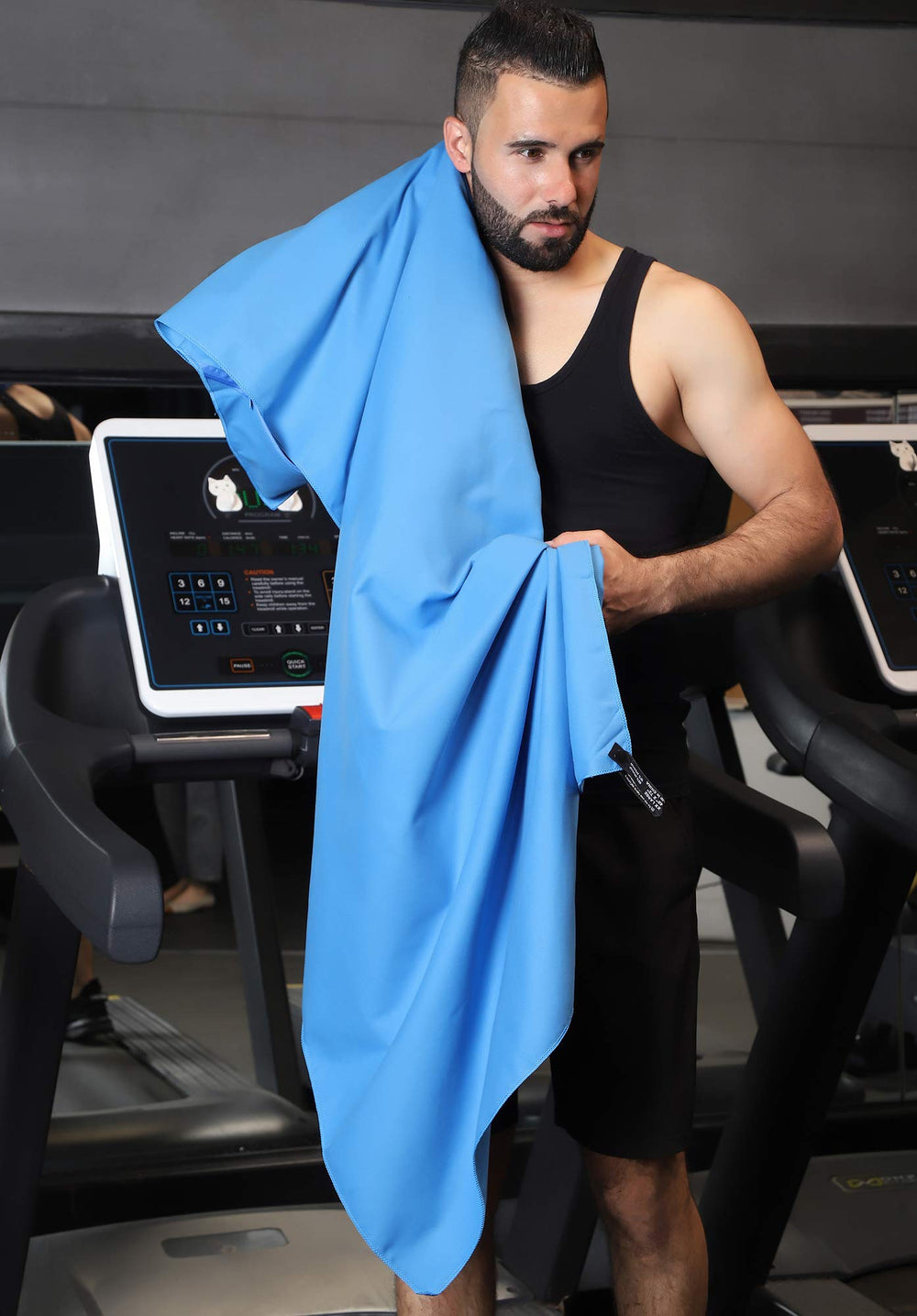 Rainleaf towel spread on beach showing sand resistance and coverage