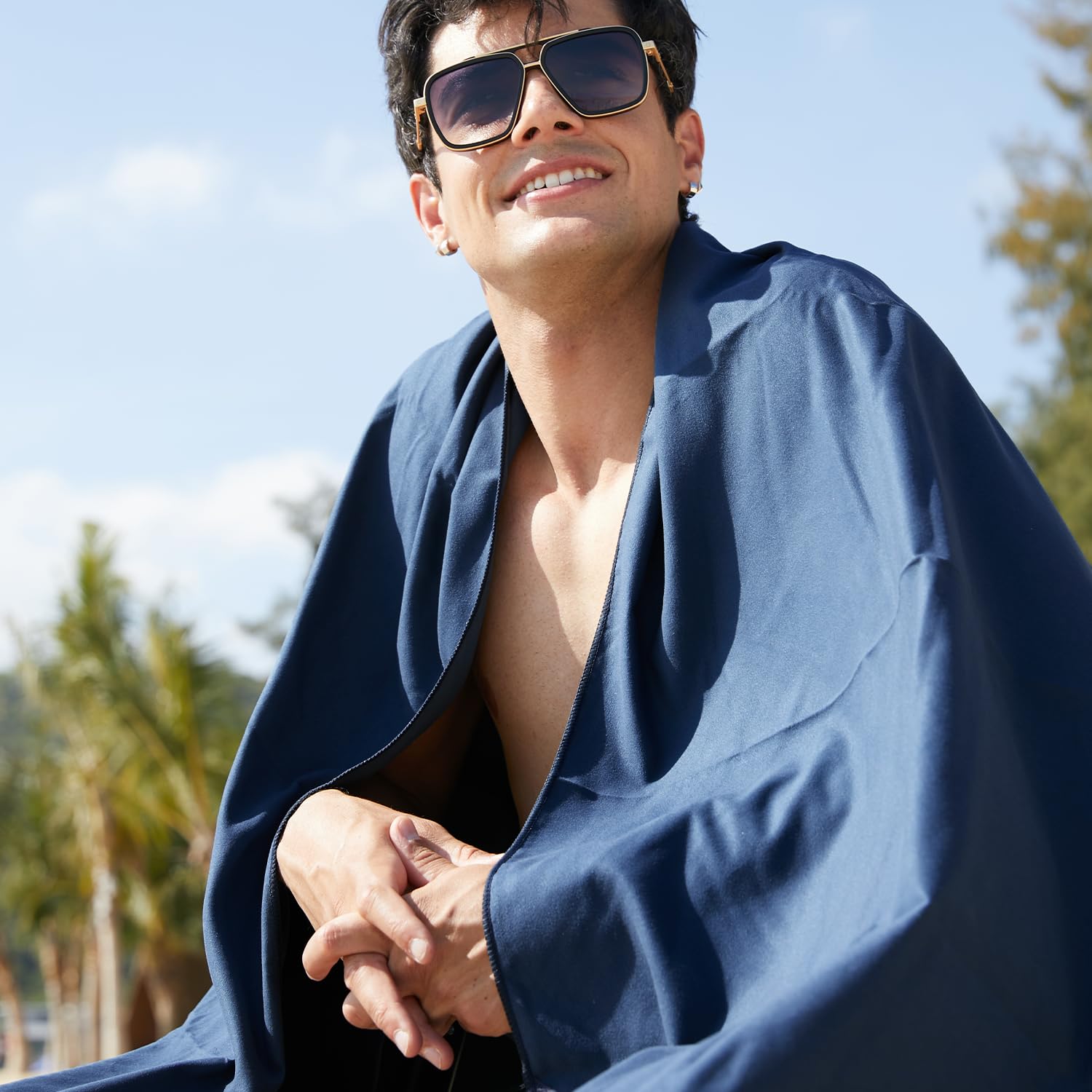 Rainleaf towel on sandy beach showing sand-resistant surface for cleaner drying