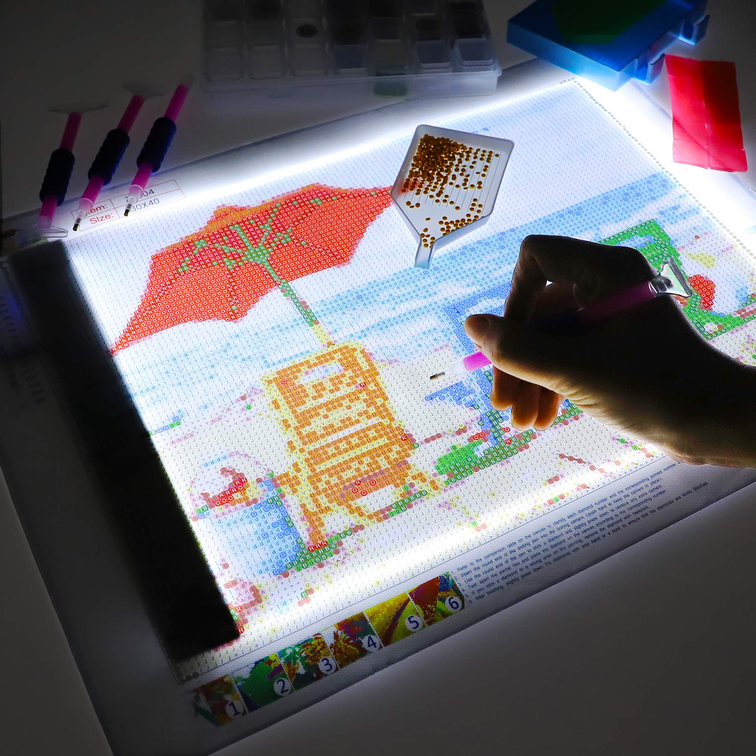 Ratukall in use with diamond painting canvas showing improved detail visibility benefit
