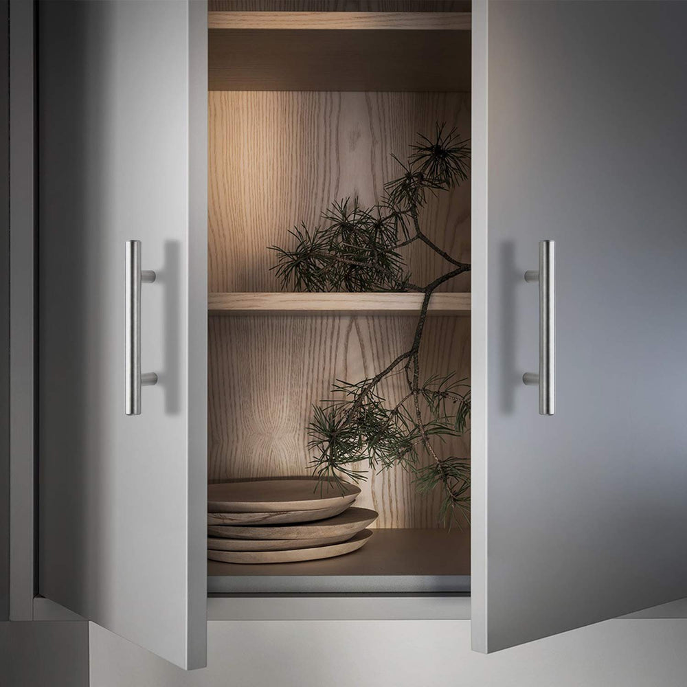 Ravinte handle installed on a white cabinet door showing cohesive look
