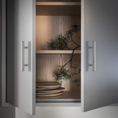 Ravinte handle installed on a white cabinet door showing cohesive look