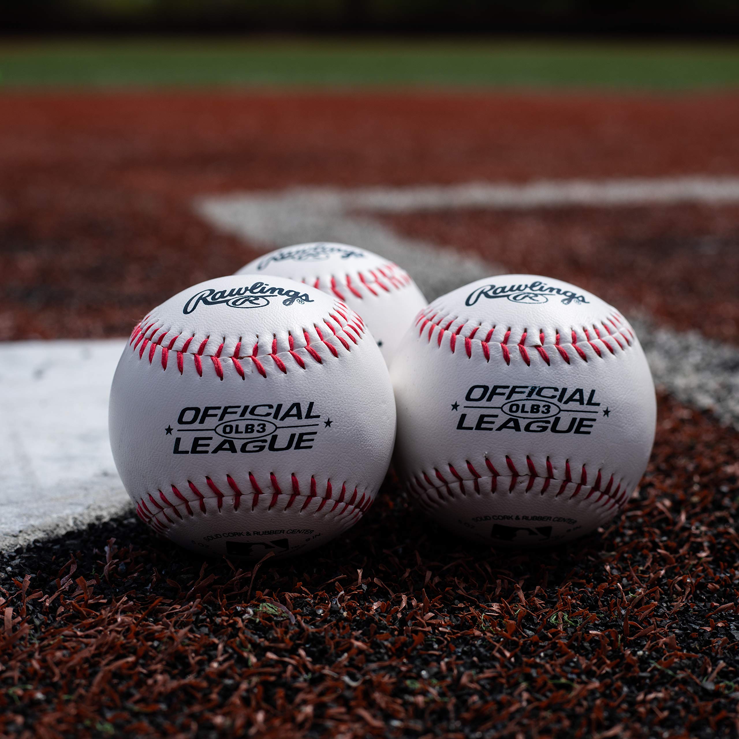 Rawlings size comparison with hand demonstrating official youth dimensions