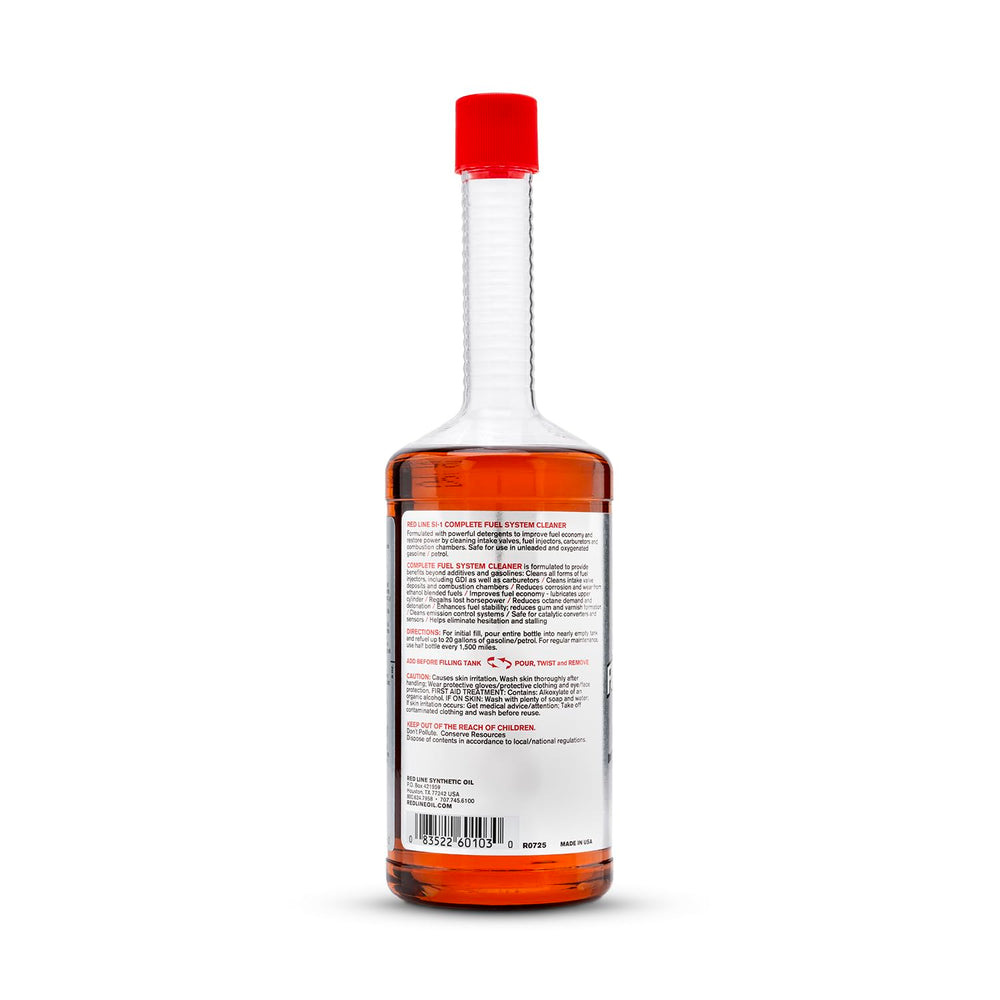 Red Line bottle on garage workbench showing professional maintenance use