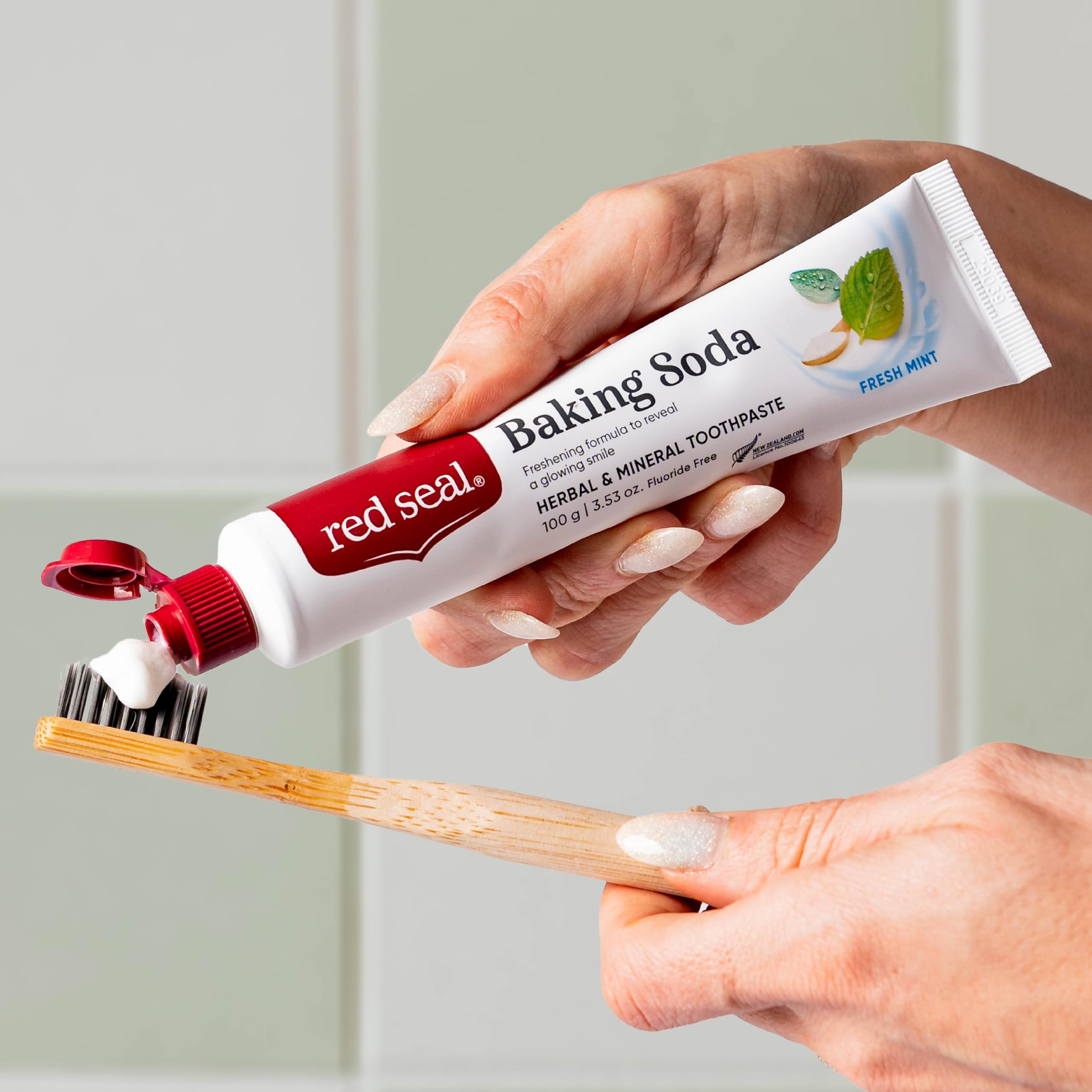 Red Seal tube beside toothbrush showing true size and convenience benefit