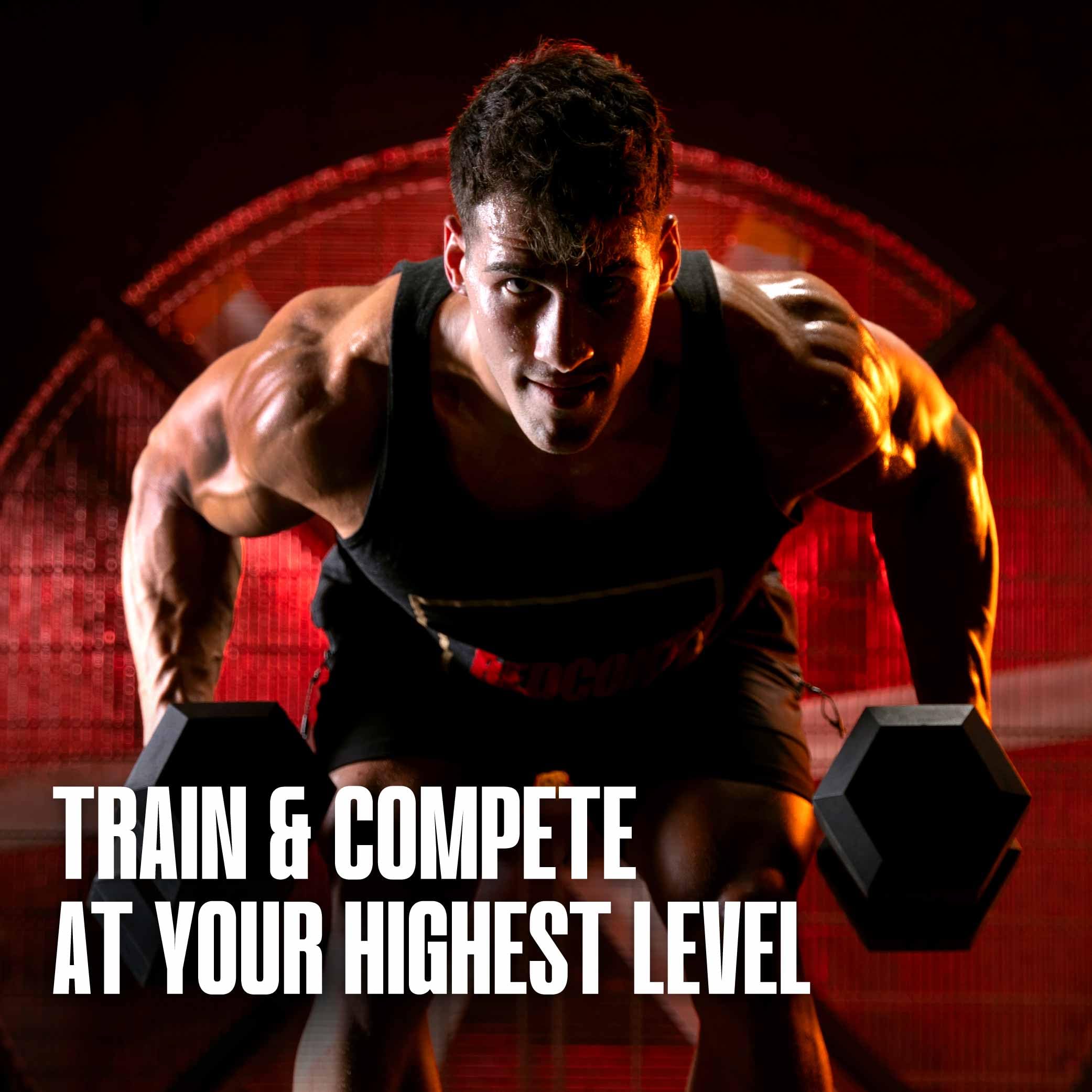 REDCON1 athlete holding tub pre-workout ready to train showing motivation boost