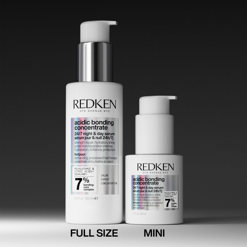 Redken mini held in hand for scale demonstrating portable, travel-friendly size