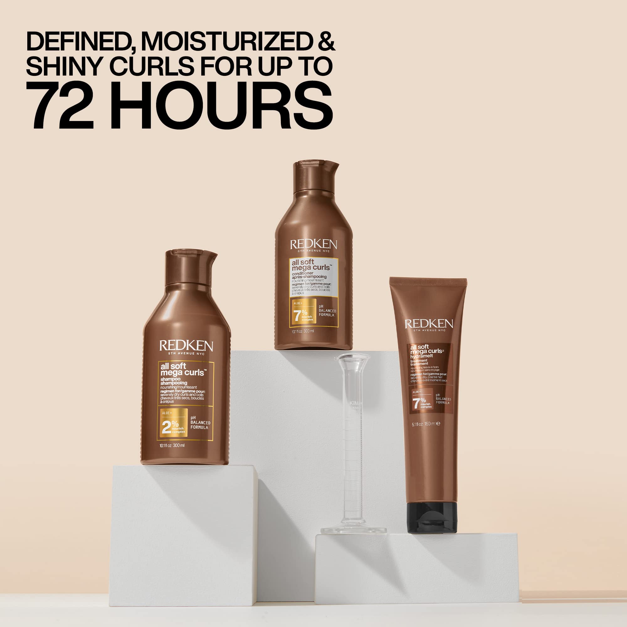 Hand applying Redken conditioner illustrating generous slip and detangling benefit