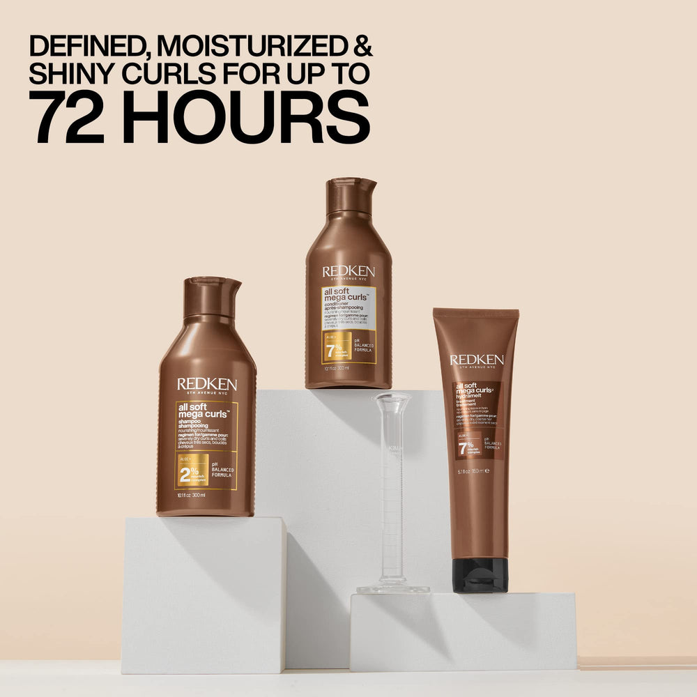 Hand applying Redken conditioner illustrating generous slip and detangling benefit