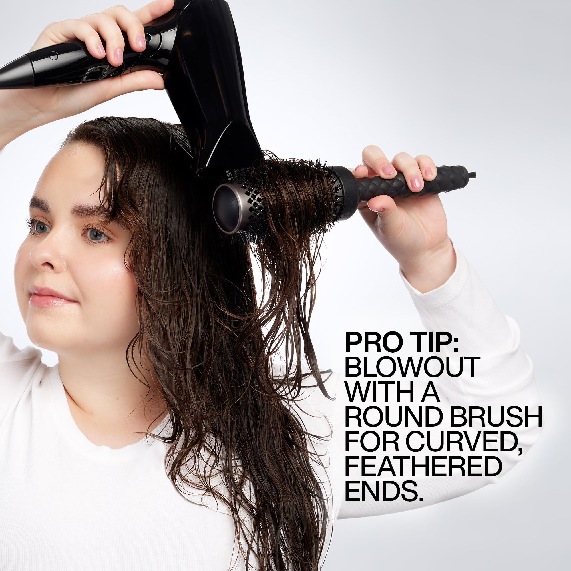 Redken Big Blowout applied to damp hair demonstrating even distribution