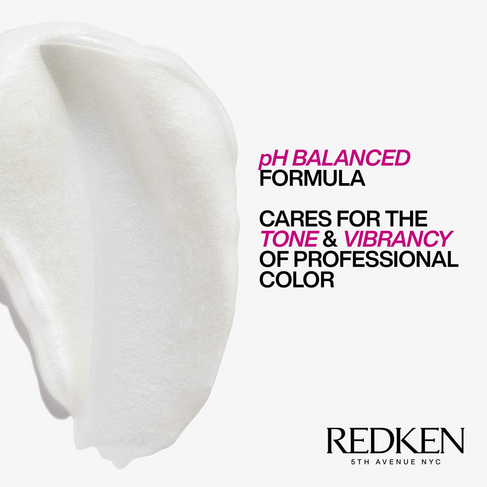 Redken bottle placed with salon tools showing professional-quality color-care benefit