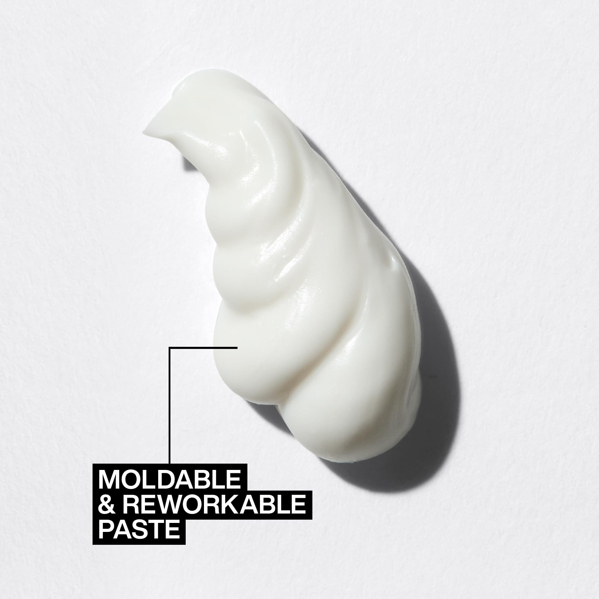 Redken paste on hands demonstrating spreadability and easy application